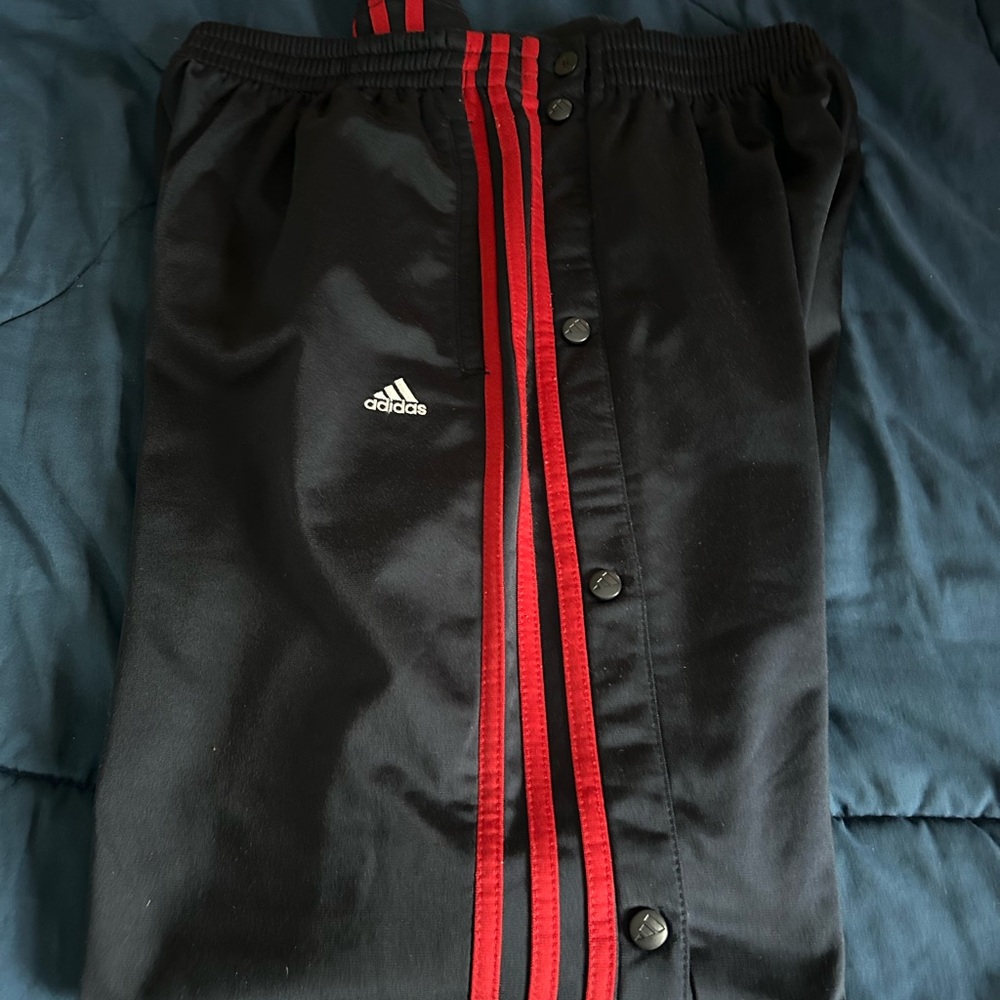 Vintage Adidas Men's Originals Classics 3-Stripes snap-button track pants.